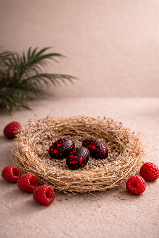 Mini œufs artisanaux chocolat noir 64 % et ganache framboise